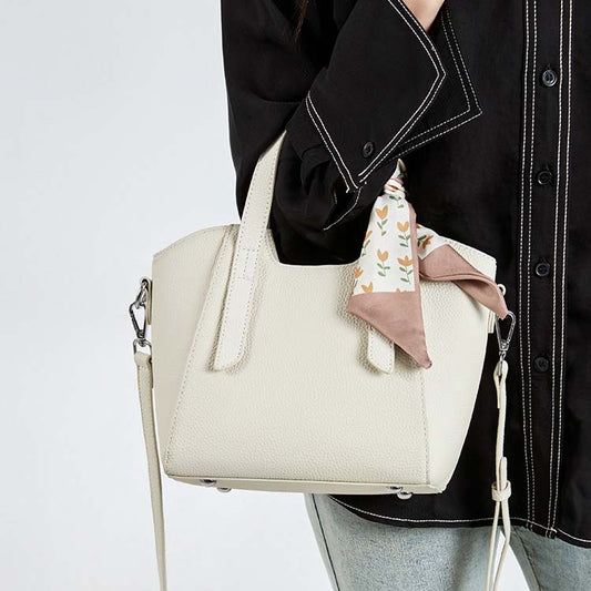 This bucket bag combines a "Fresh & Sweet" aesthetic with high-end durability.