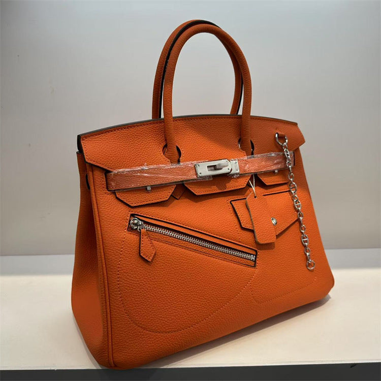Orange handbag with silver hardware