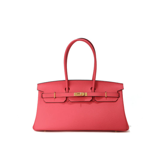 Red handbag with gold hardware