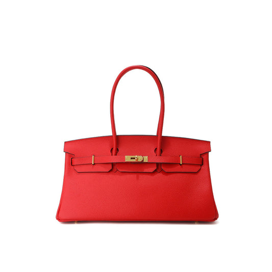 Red handbag with gold hardware
