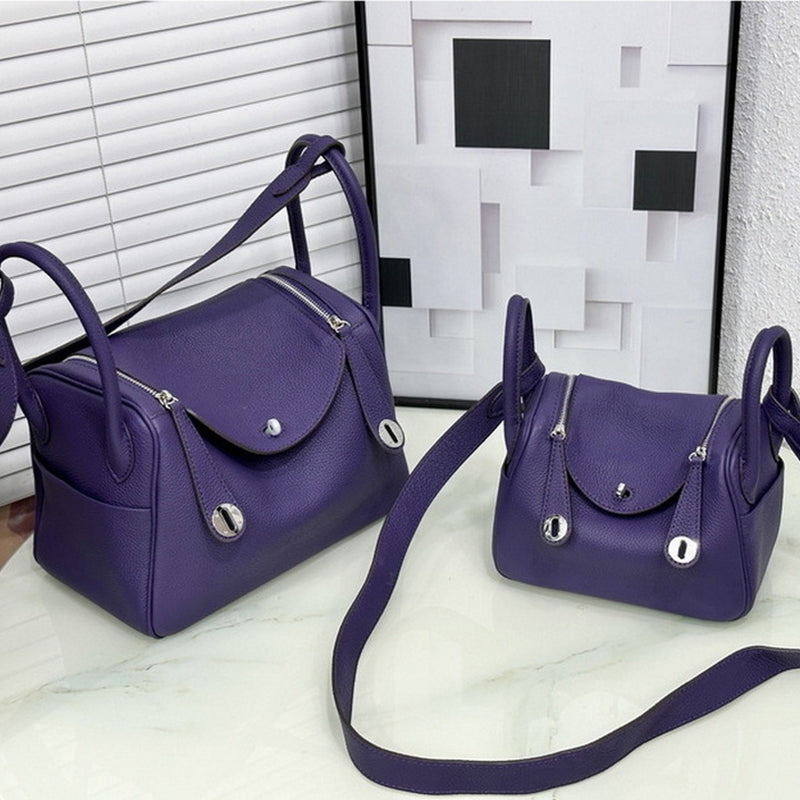 Dark purple top grain leather Lindy bags in small and medium sizes with silver hardware