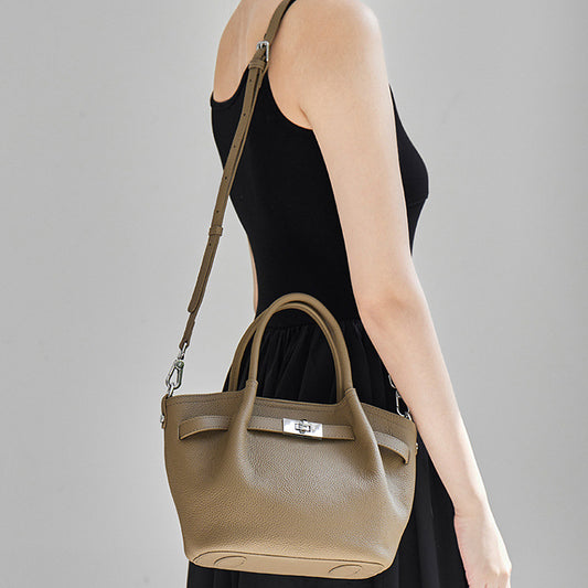 Elegant TC textured leather tote bag in taupe with 2-way carry strap and silver hardware buckle.