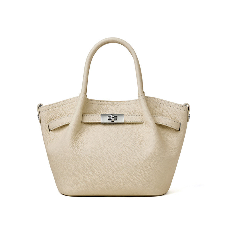Beige TC textured leather commuter tote bag, 2-way carry handbag with silver turn-lock buckle.