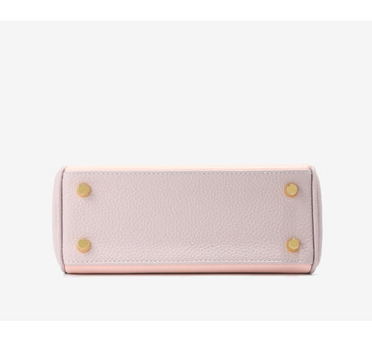 Bottom view of bi-color Pink and Light Purple mini Kelly 20 bag with gold protective feet