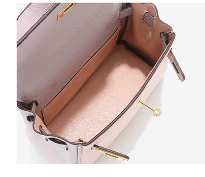 Interior view of bi-color Pink and Light Purple mini Kelly 20 bag with side pocket