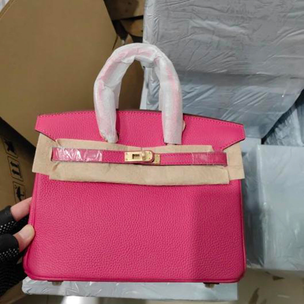 Rose red genuine leather handbag with gold-tone hardware.
