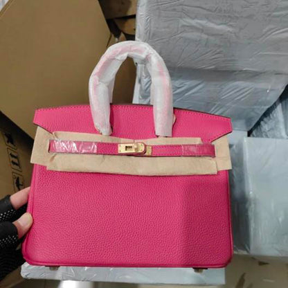 Rose red genuine leather handbag with gold-tone hardware.