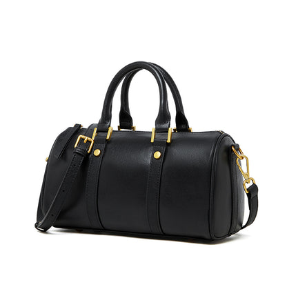 Black top grain leather Boston bag with retro design and gold hardware.
