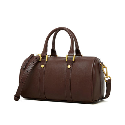 Brown top grain leather Boston bag with retro design and gold hardware.