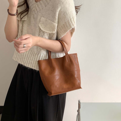 Brown premium cowhide leather mini tote bag, elegant 2-way commuter handbag for women.