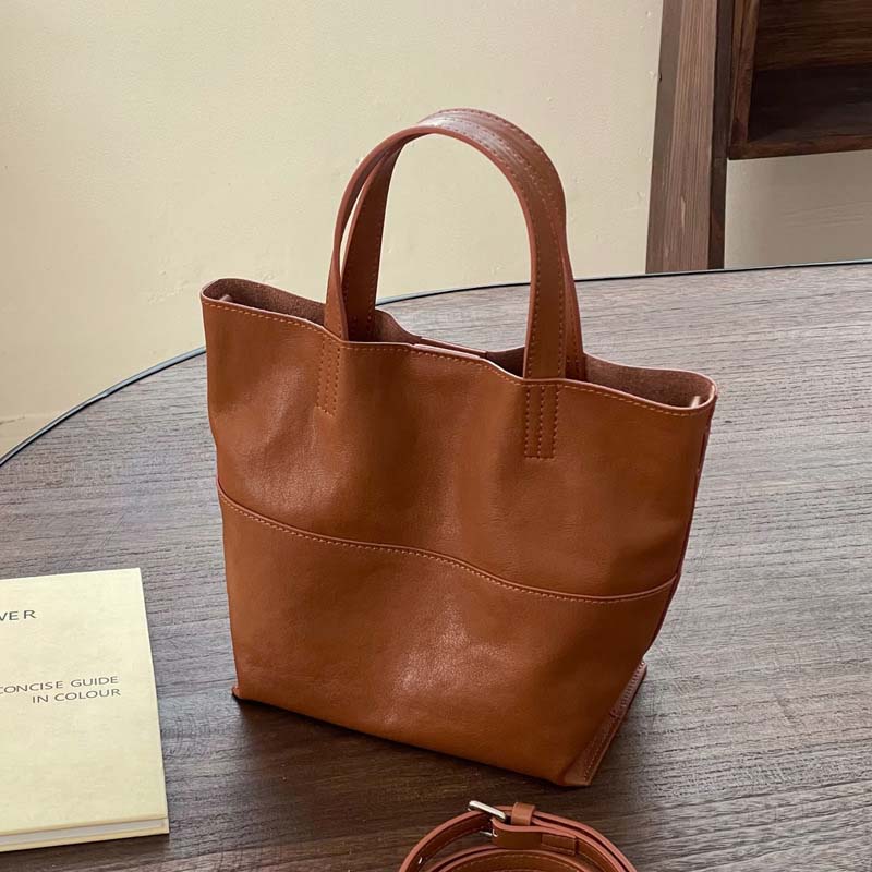 Brown premium cowhide leather mini tote bag, minimalist 2-way commuter handbag with top handles.
