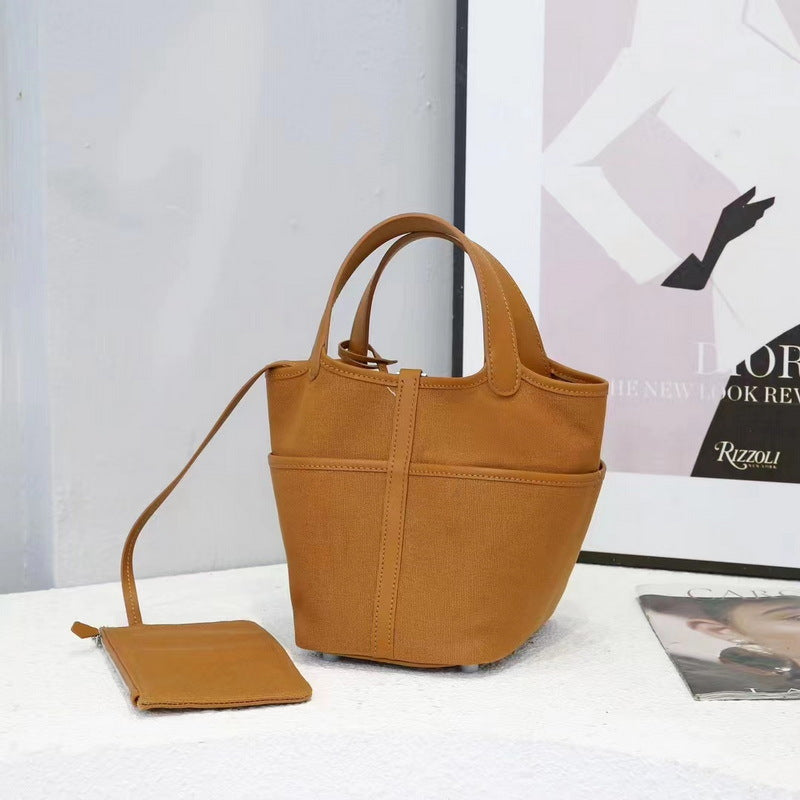 A brown Cargo Picotin 18 handbag, crafted from a combination of leather and canvas, and accompanied by a matching mini pouch.