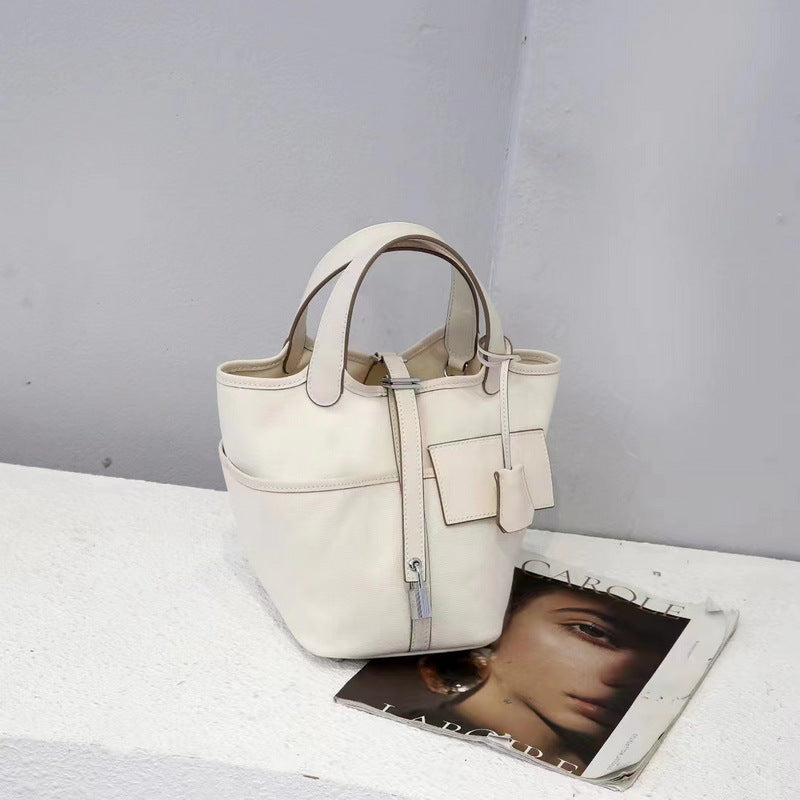 A white Cargo Picotin 18 handbag, crafted from a combination of leather and canvas and featuring a silver-tone clasp.