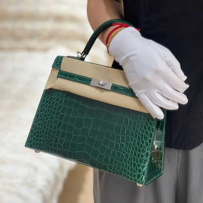 Dark green crocodile embossed leather Kelli bag with silver hardware and protective felt