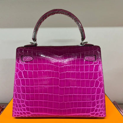 Back view of rose purple crocodile embossed leather Kelli bag with silver hardware