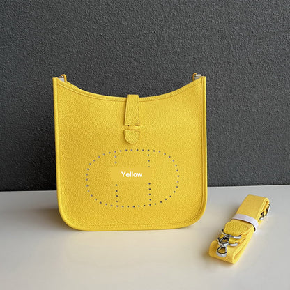 Yellow pebbled leather Eveline crossbody bag with silver hardware and a matching detachable strap.