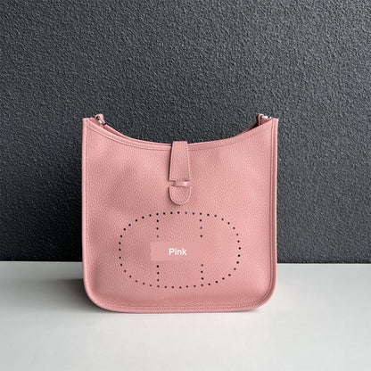 Pink pebbled leather Eveline crossbody bag with silver hardware and iconic perforated design.