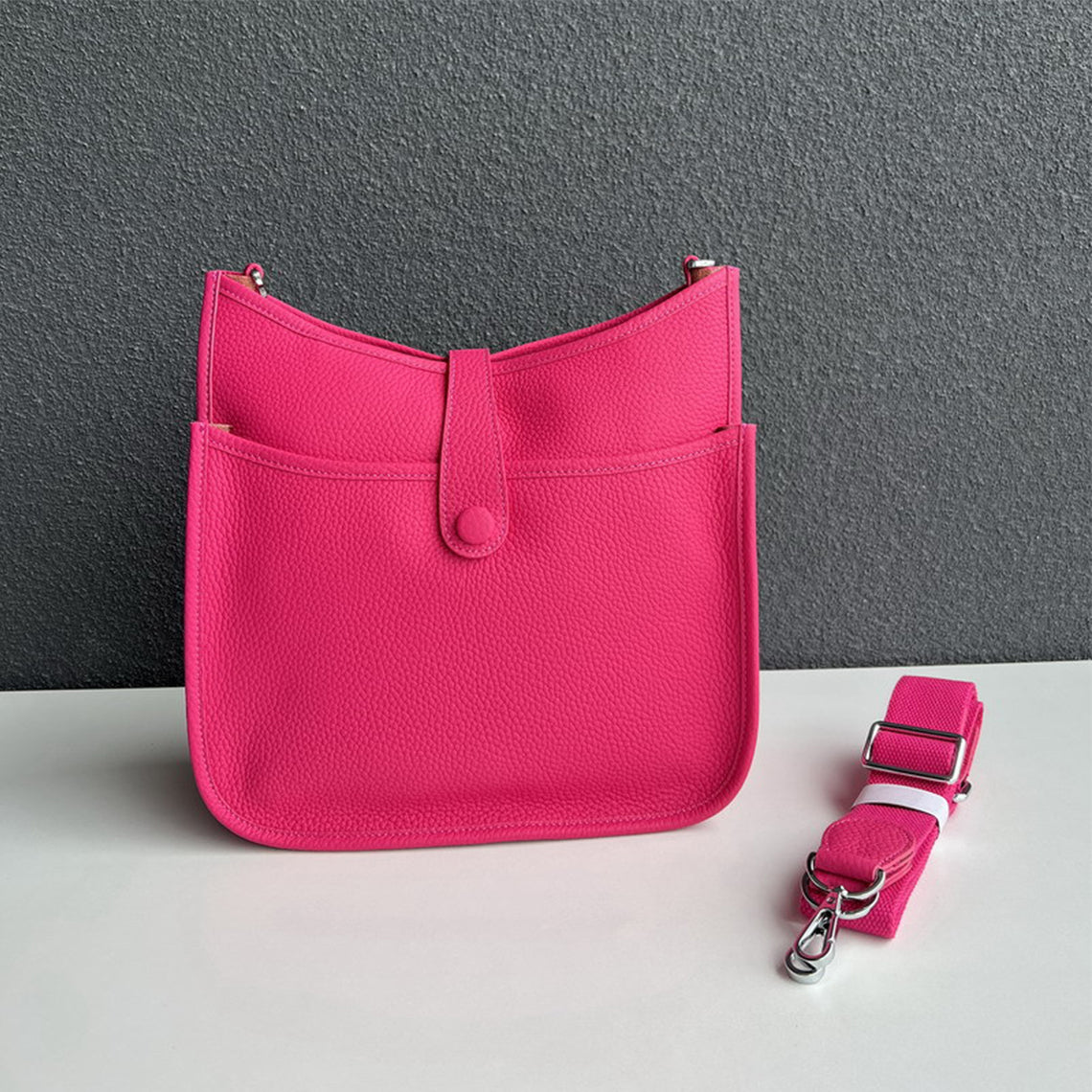 Rose Pink pebbled leather Eveline crossbody bag with silver hardware and a matching detachable strap.
