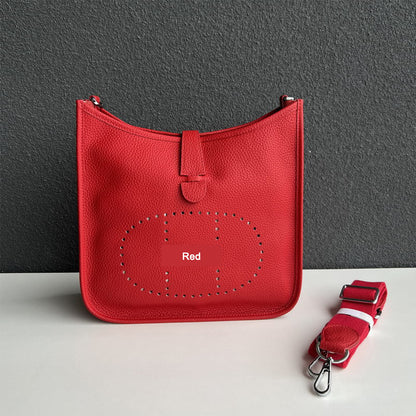 Red pebbled leather Eveline crossbody bag with silver hardware and a matching detachable strap.