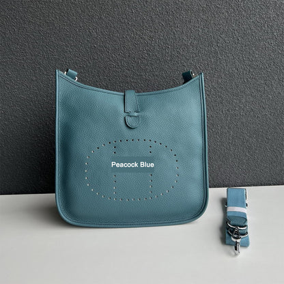Peacock Blue pebbled leather Eveline crossbody bag with silver hardware and a matching detachable strap.