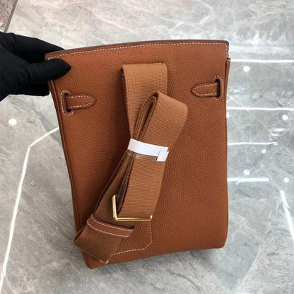 Gold Brown  Leather Designer Cross body Bag with Gold Hardware and a Canvas Strap.