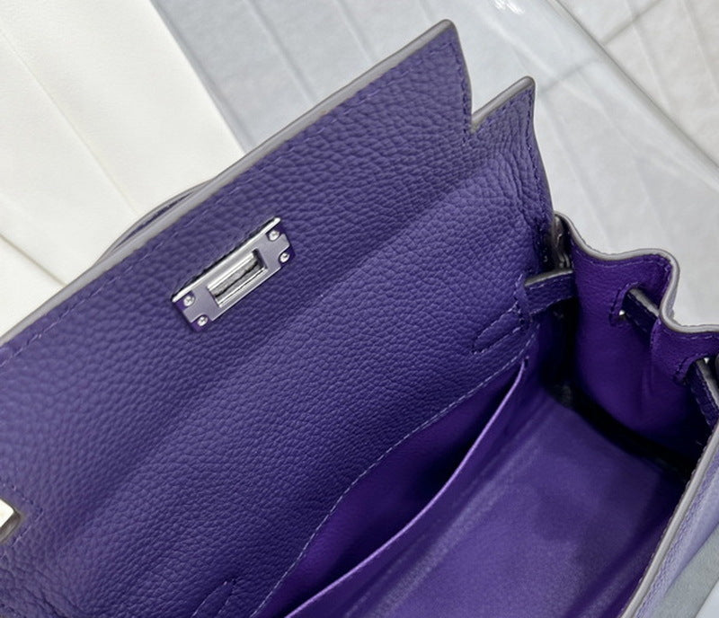 High-quality leather interior and silver-tone hardware of the Anemone purple Kelli mini bag.