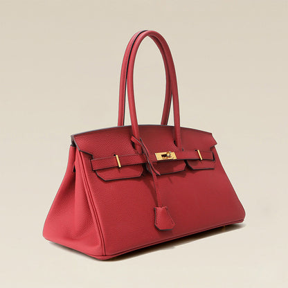 Red handbag with gold hardware
