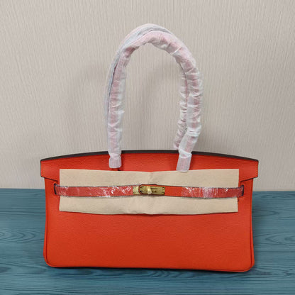 Orange Top Grain Leather JPG Birkin Inspired Long Handle Shoulder Bag in 40cm with Gold Hardware and a structured horizontal silhouette.
