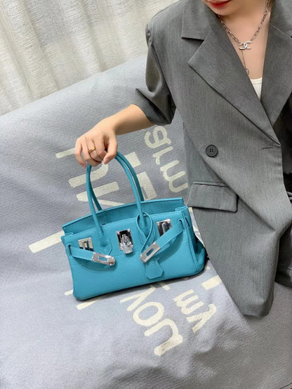 Northern Blue inspired JPG Birkin handbag featuring premium top grain leather, silver-tone lock closure, and classic 14 cm top handles for a chic, durable look.