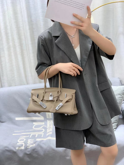 Gray inspired JPG Birkin handbag featuring premium top grain leather, silver-tone lock closure, and classic 14cm top handles for a chic, durable look.