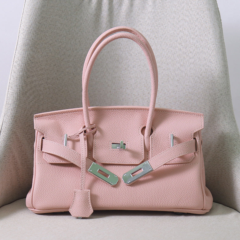 Front view of a Rose Sakura JPG Birkin inspired handbag in textured top grain cowhide leather, featuring classic lock closure and 14cm tall double handles.