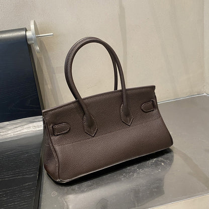 Rear view of a Khaki JPG Birkin inspired handbag in textured top grain cowhide leather, highlighting the clean stitching and 14 cm tall double top handles.
