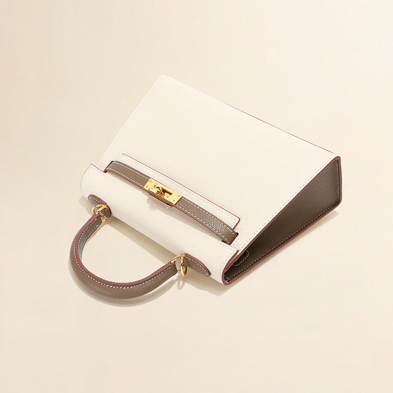 Elegant white and grey bi-color leather Kelli bag with signature gold-tone hardware.