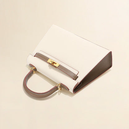 Elegant white and grey bi-color leather Kelli bag with signature gold-tone hardware.