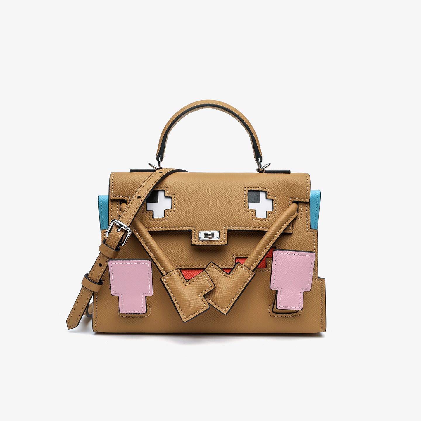 Front view of the Inspired Kelly Doll Picto Quelle Idole handbag in brown Epsom leather, featuring a whimsical mosaic face design with pink leather accents and a silver turn-lock.