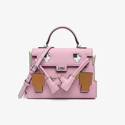 Pink Epsom leather Picto Kelly Doll bag with pixelated face design, tan accents, and a matching top handle.