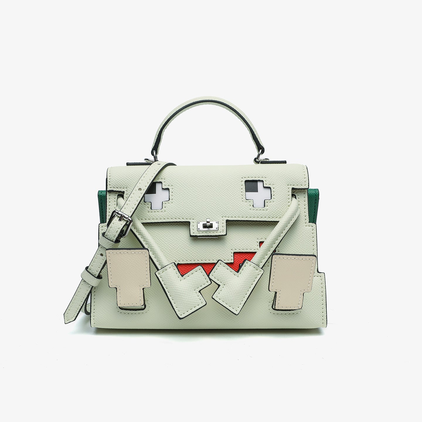 Grass Green Epsom leather Picto Kelly Doll bag with pixelated face design, tan accents, and a matching shoulder strap.