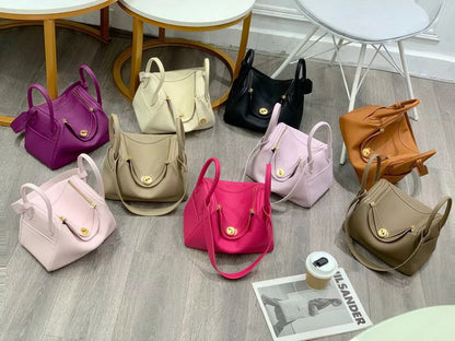 Collection of Lindy bags in various new colors including pink, purple, tan, and black top grain leather.
