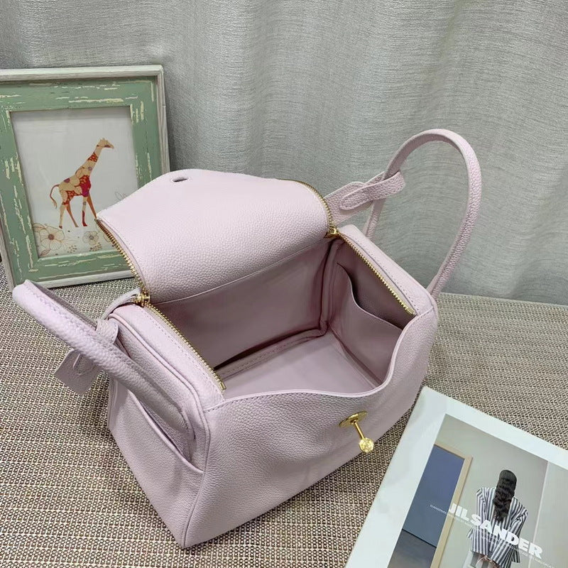 Interior view of Fantasy Purple Lindy bag showing spacious compartment and side pocket