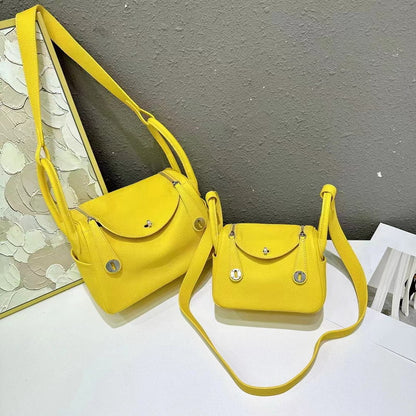 Chicken yellow top grain leather Lindi bags in small and medium sizes with silver hardware