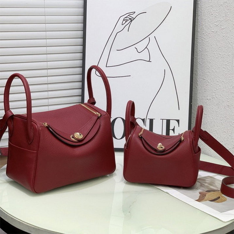 Angolan red top grain leather Lindy bags in two sizes with golden hardware