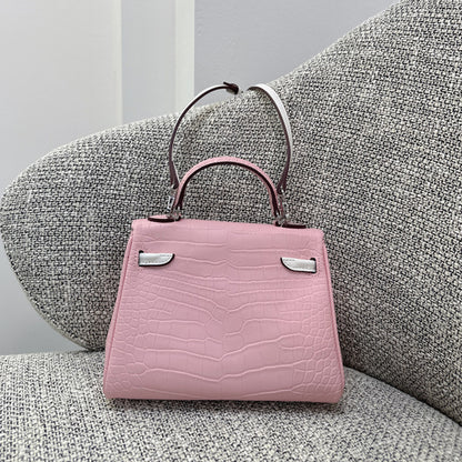 Elegant pink croc-embossed leather mini bag, perfect for a feminine and luxury look.