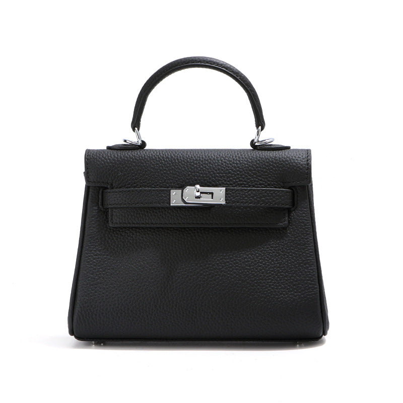 Front view of a black mini Kelli handbag in top grain pebbled leather with sleek silver hardware.