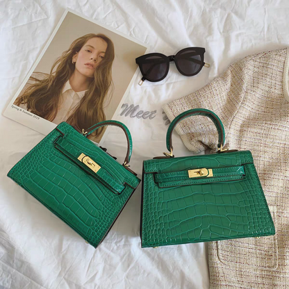 Deep Green croc-embossed leather mini Kelly handbag with gold-tone lock and top handle.