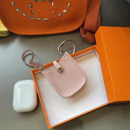 Pink mini Eveline leather AirPods holder and luxury bag charm in gift box