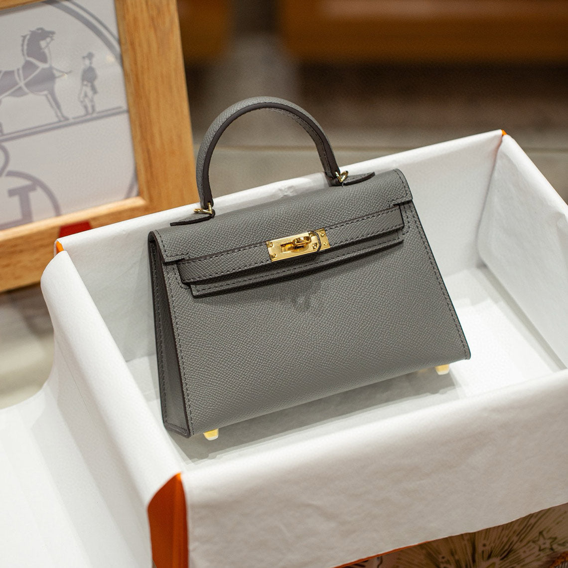 Gray Kelly handbag with gold hardware 