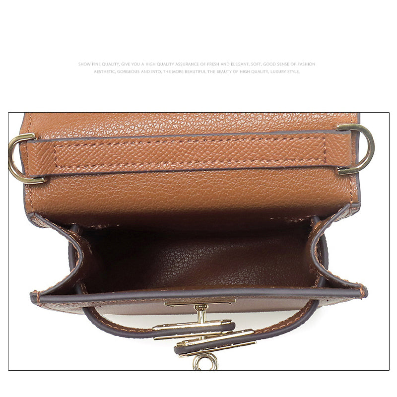 Interior view of Brown genuine leather mini phone bag showing open compartment and leather lining.