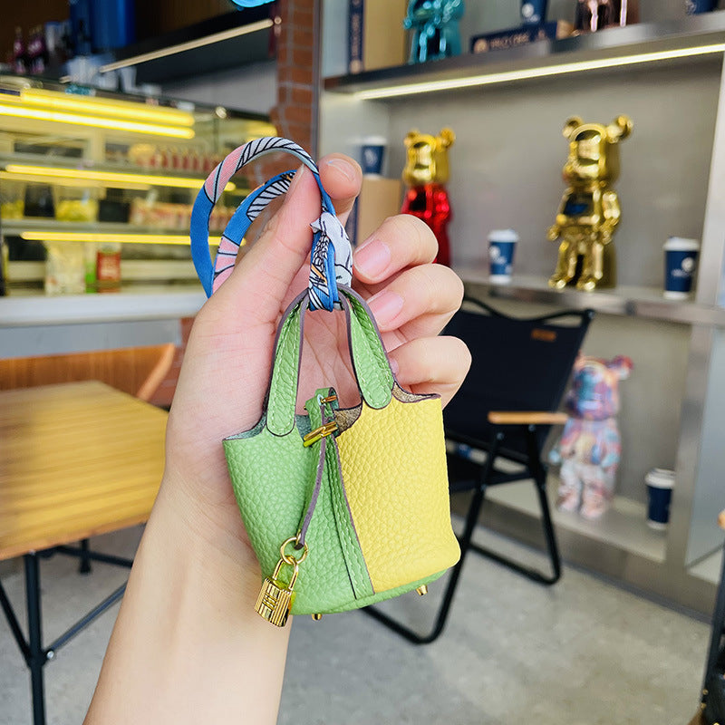 Two-tone green and yellow mini leather Picotin bag charm with gold lock.