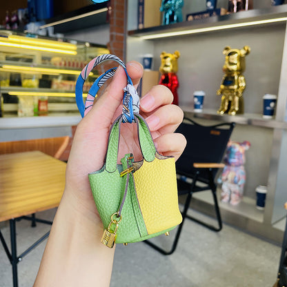 Two-tone green and yellow mini leather Picotin bag charm with gold lock.