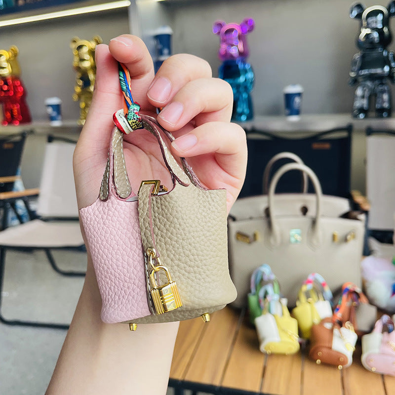 Two-tone pink and grey mini leather Picotin bag charm with gold lock.